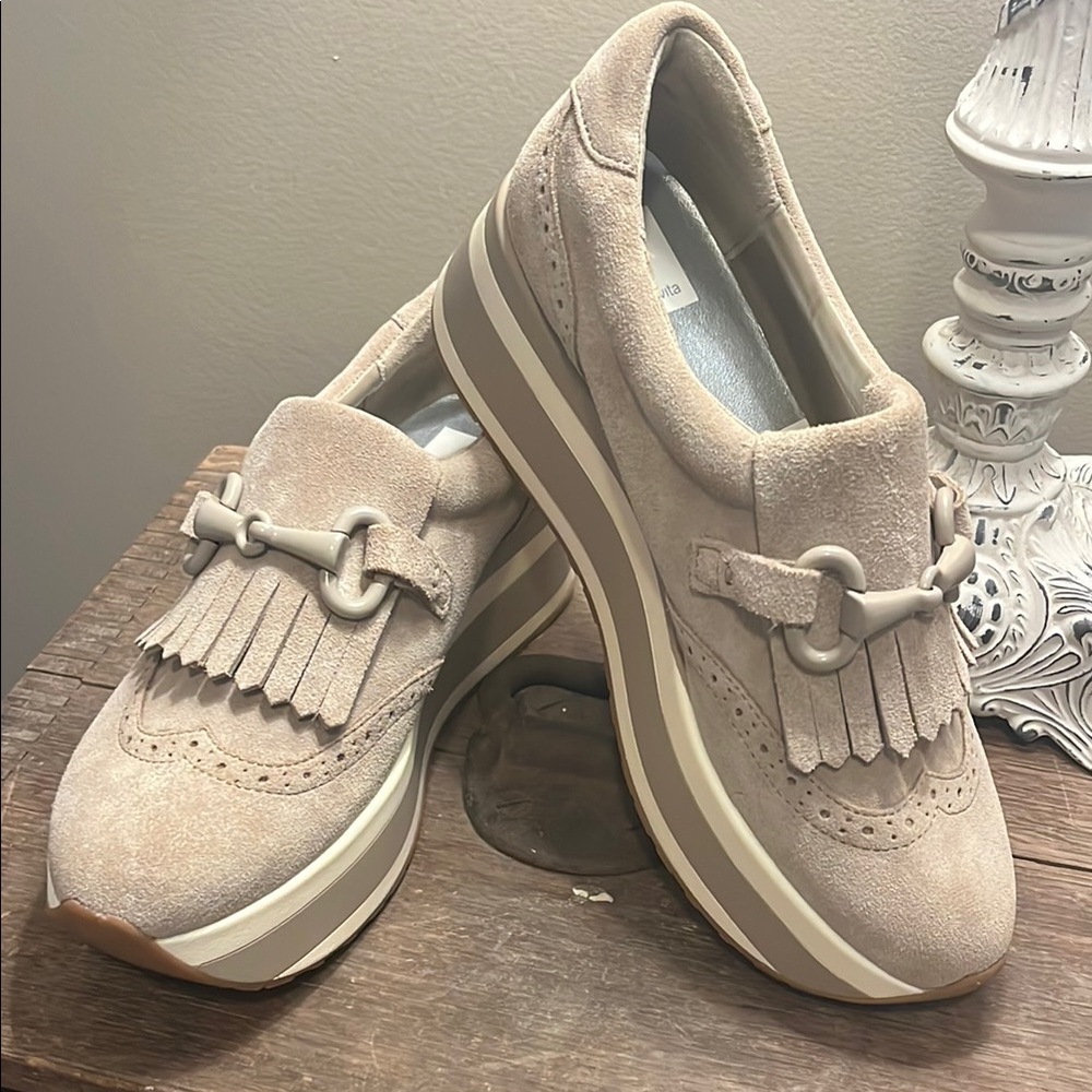 Cream loafers with fringe tassels and chunky platform sole